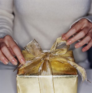 Woman Unwrapping a Gift